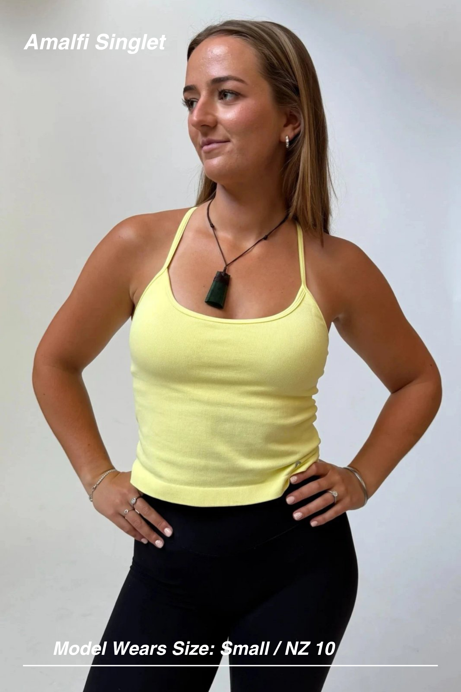 Mint Activewear Amalfi ribbed singlet in yellow, built-in bra, front view, hands on hips