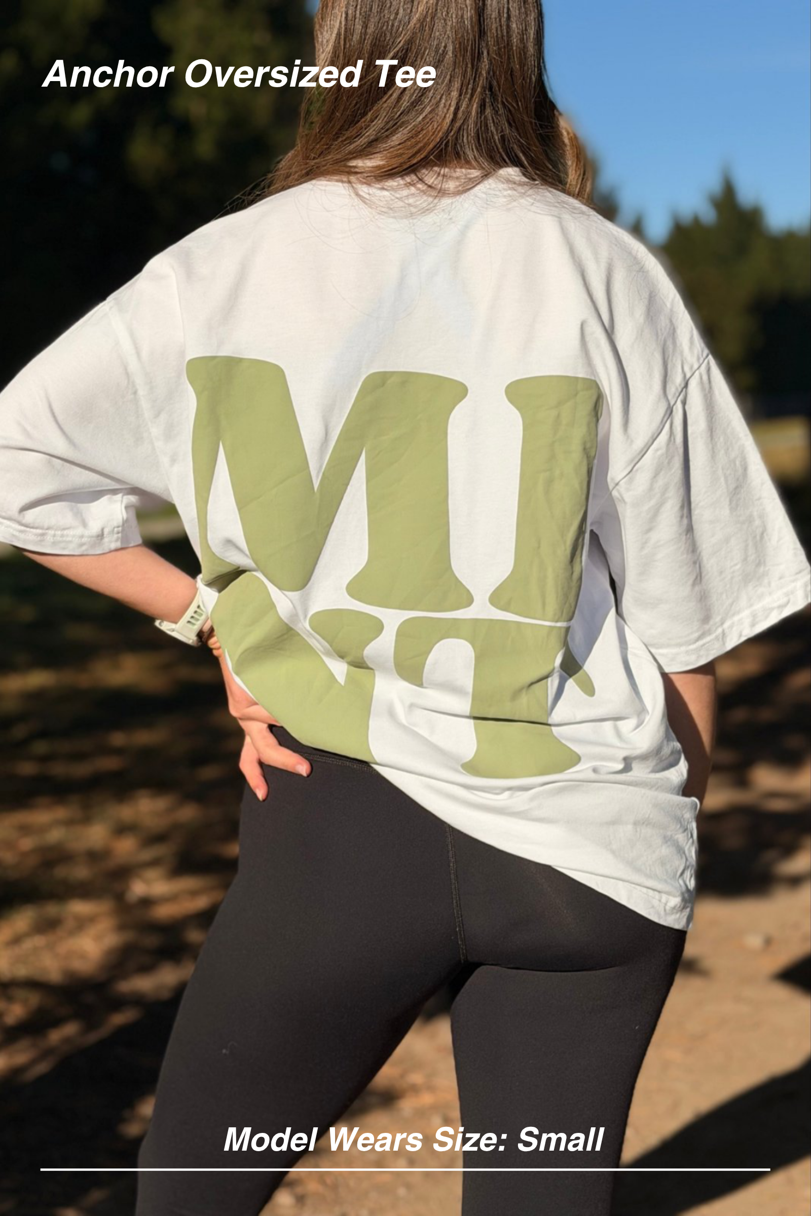Mint Activewear Anchor Oversized Tee in white, close back view of the green MINT print and roomy oversized fit.