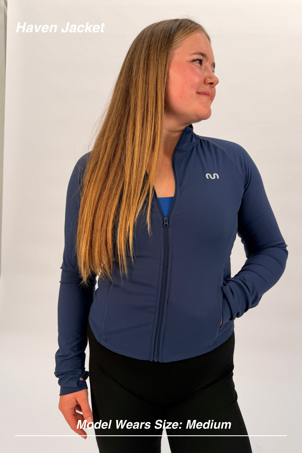 Mint Activewear Haven Jacket in navy, front three-quarter view with full-length zip and silver M logo.