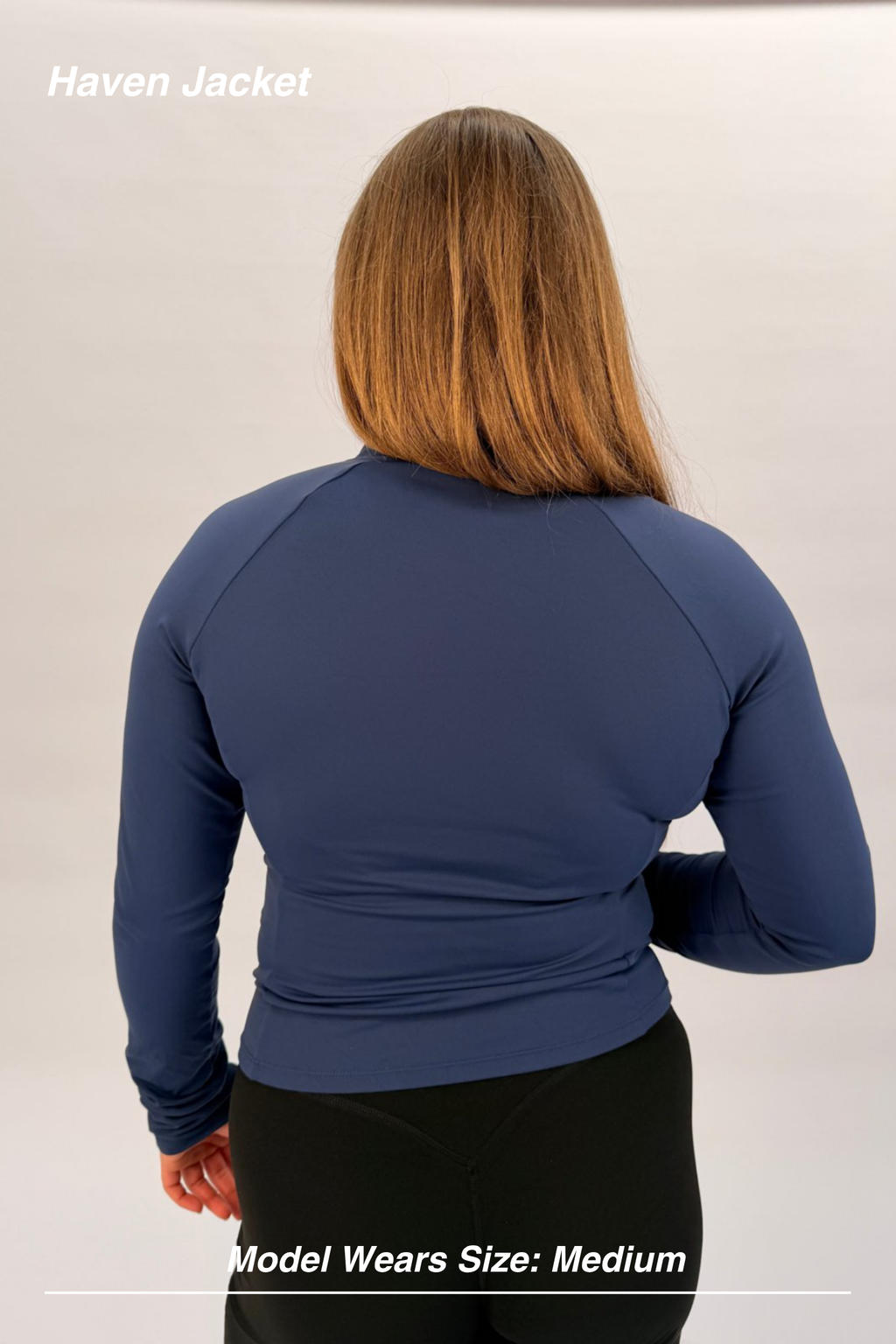 Mint Activewear Haven Jacket in navy, back view showing contour stitching and athletic fitted shape.