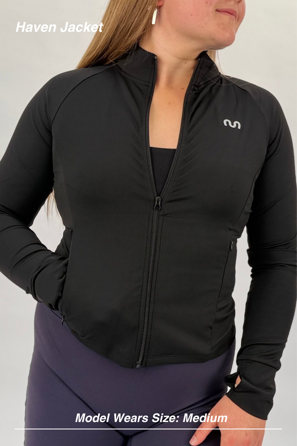 Mint Activewear Haven Jacket in black, front view with hidden zip pockets and sleek athletic fit.