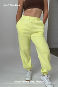 Mint Activewear Just Trackies in yellow, front view showing the elasticated drawstring waistband and side pockets.