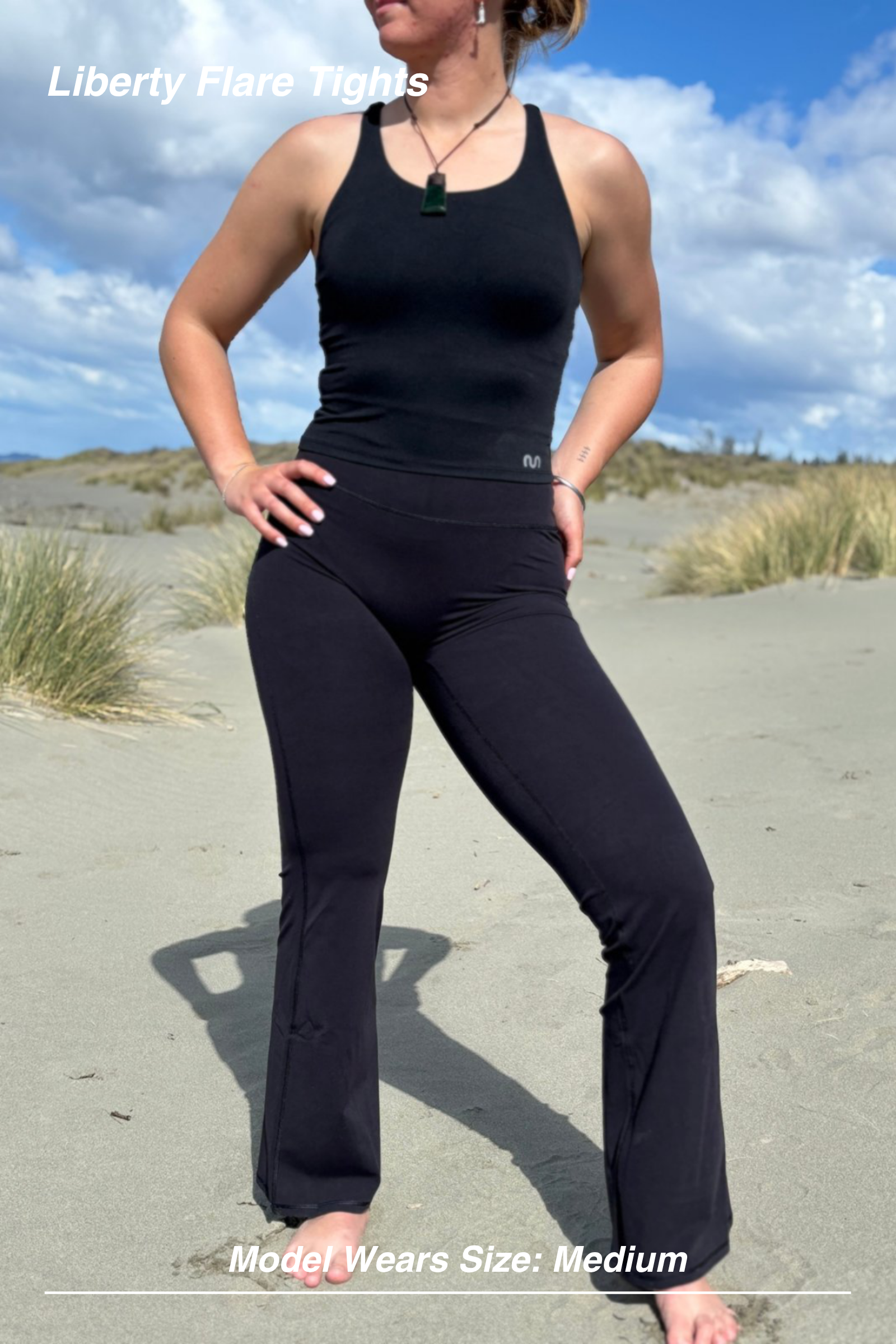 Mint Activewear Liberty Flare Tights in black styled with a matching black tank, front view of the full outfit.