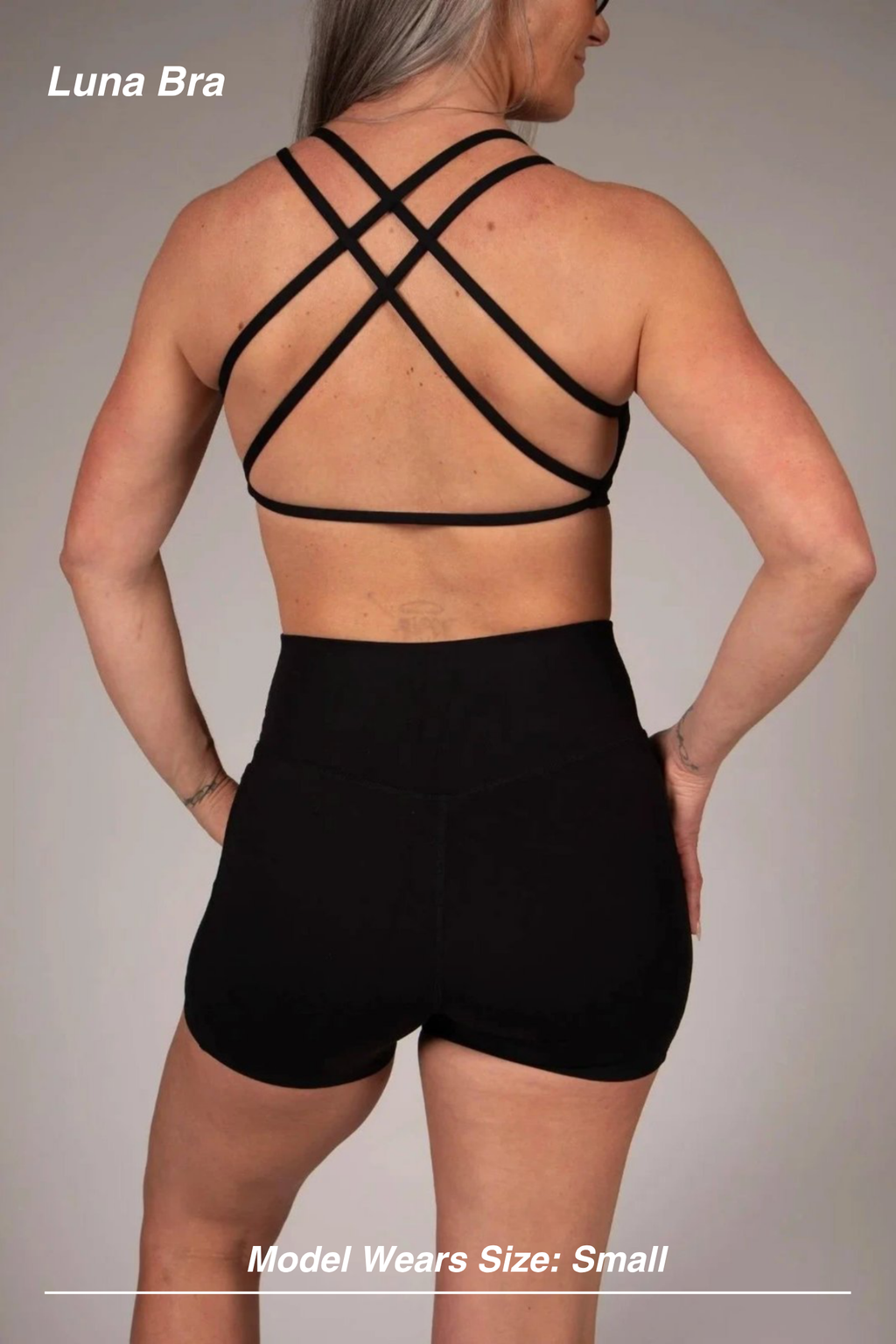 Mint Activewear Luna Bra in black, back view highlighting the multi-strap crossed strappy back.