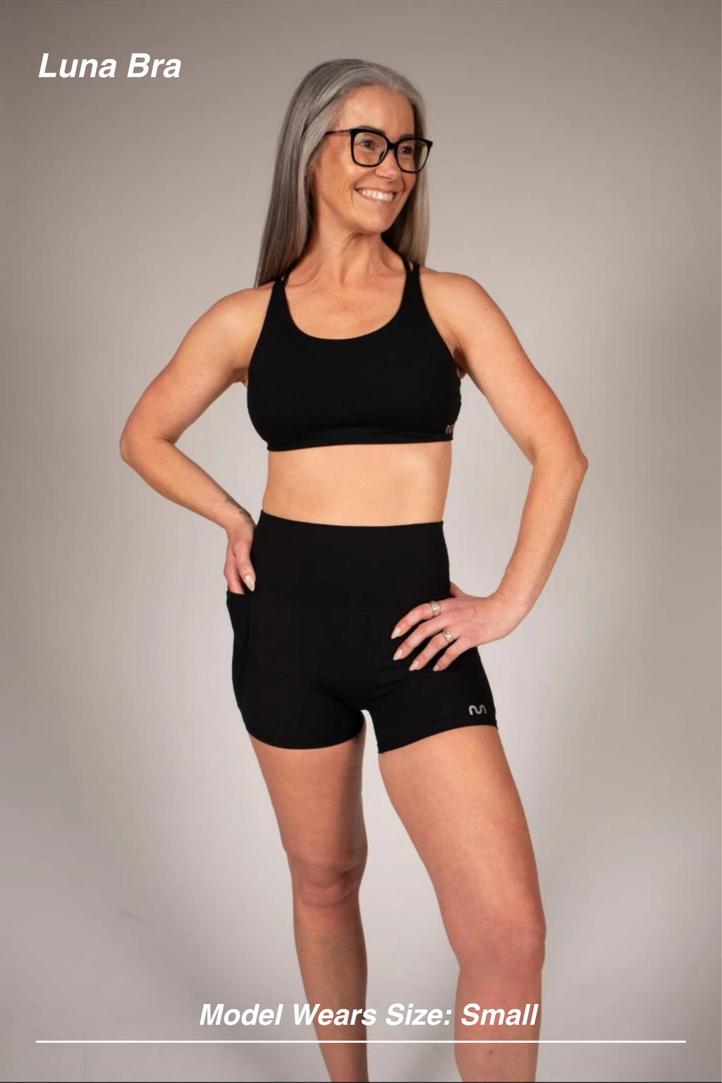 Mint Activewear Luna Bra in black, front view on model, plain front with mid-support coverage.