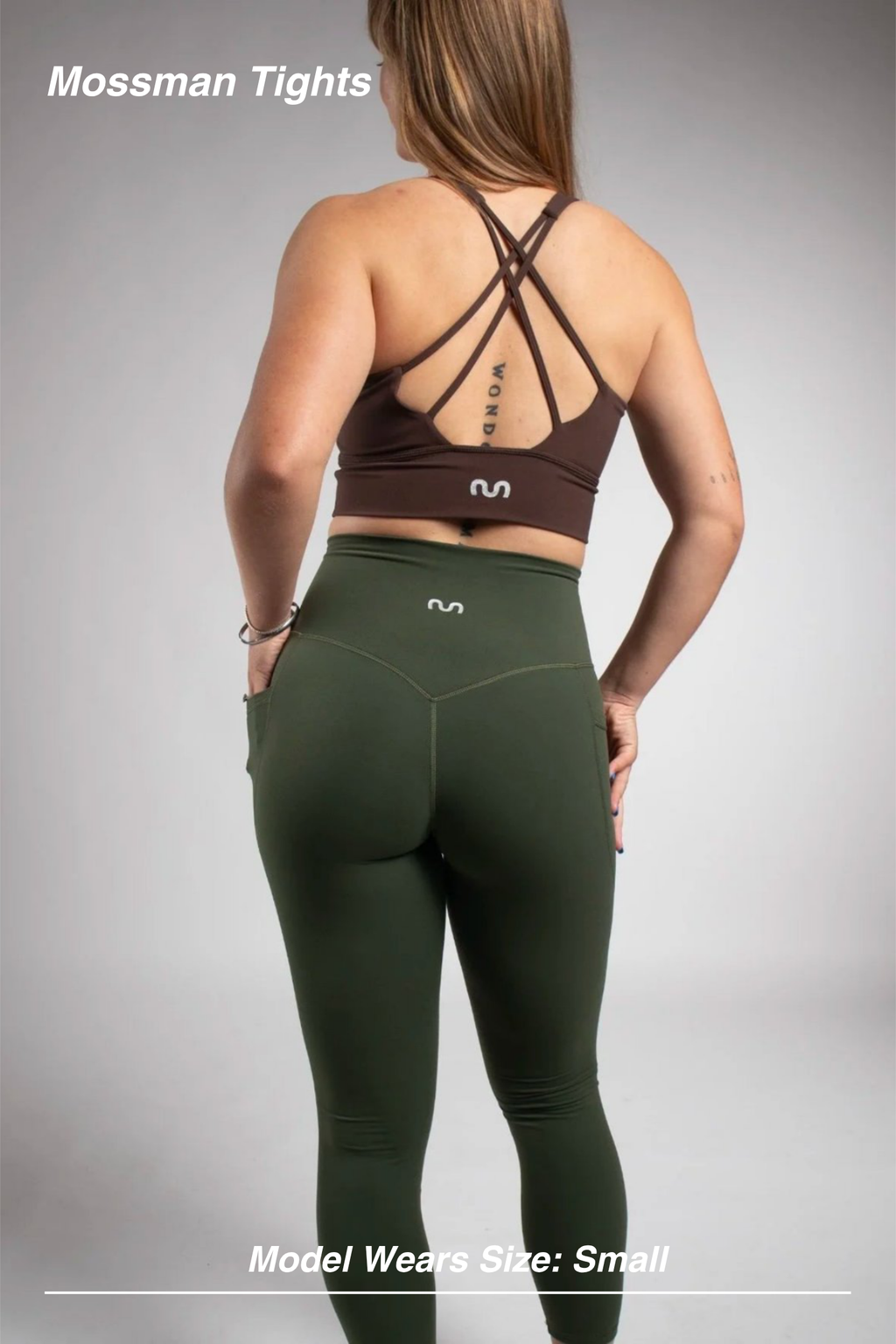 Mint Activewear Mossman Tights in olive green, close back view highlighting the V-shaped waistband and side pockets.