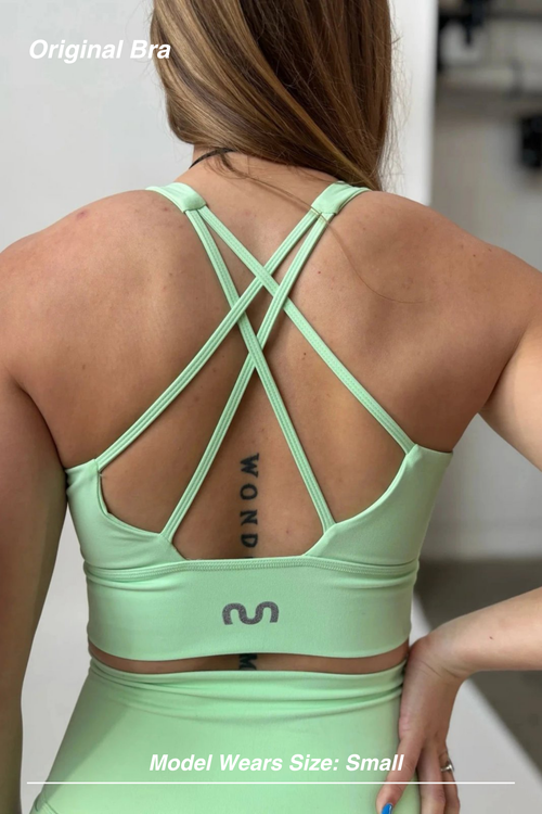 Mint Activewear Original Bra in mint green, back view showing the strappy crossed-back design and supportive band.