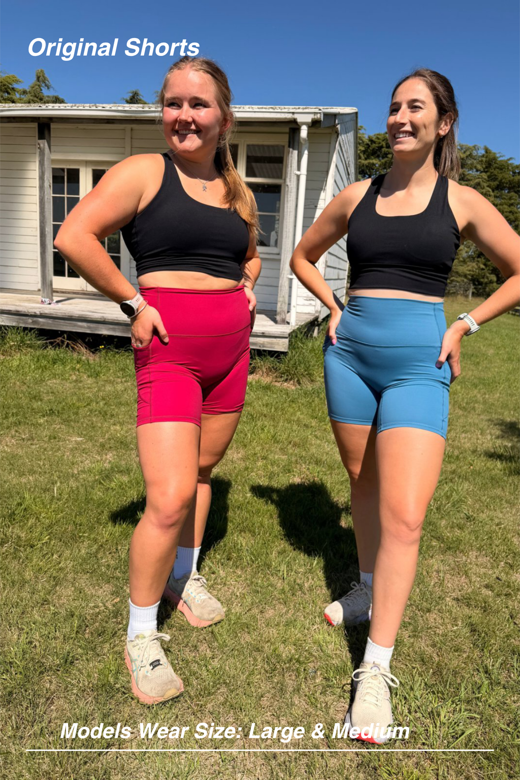 Mint Activewear Original Shorts in raspberry and dusky blue, front view on two models standing outdoors.
