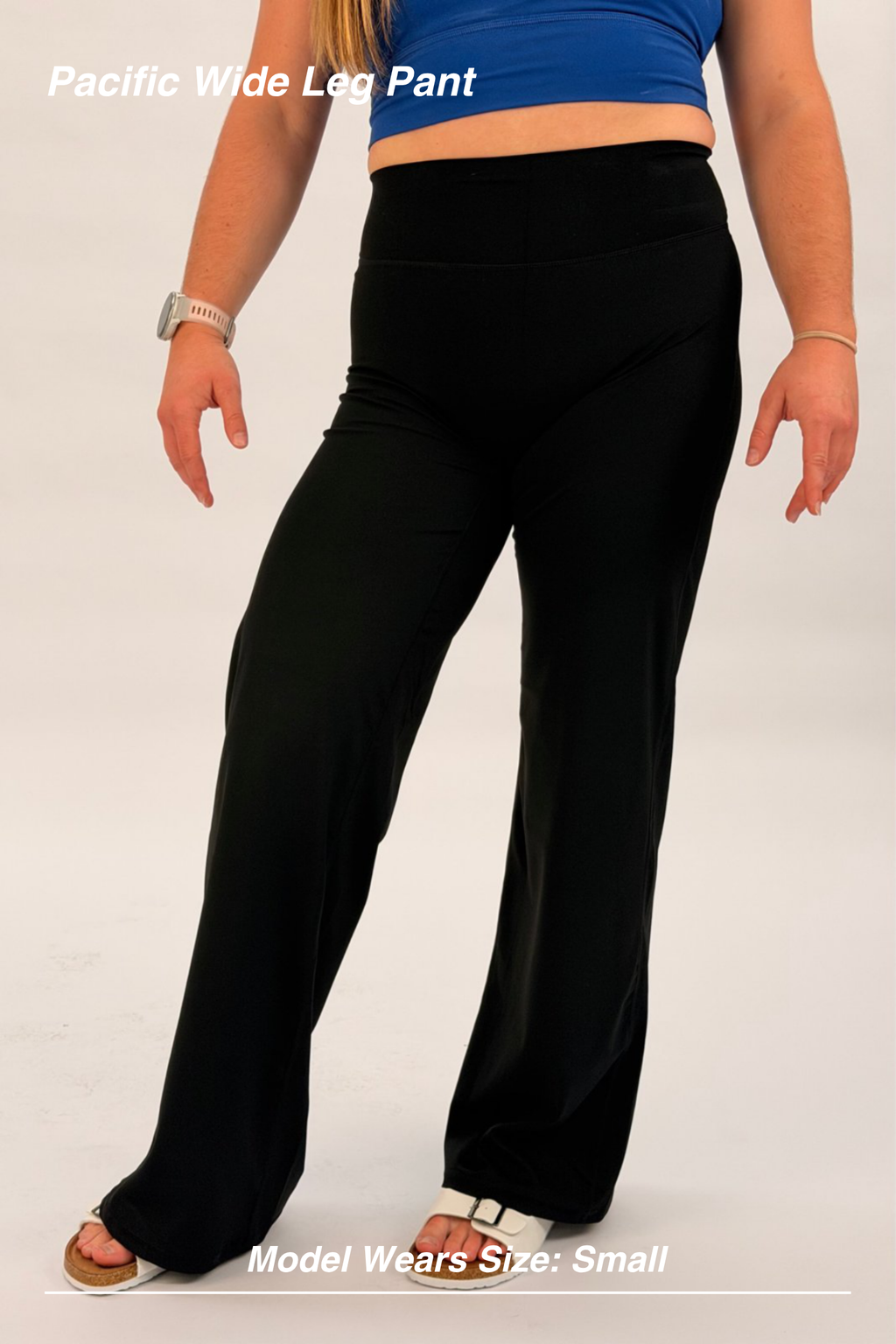 Mint Activewear Pacific Wide Leg Pant in black, front close-up of the smooth high waistband and loose wide-leg drape.