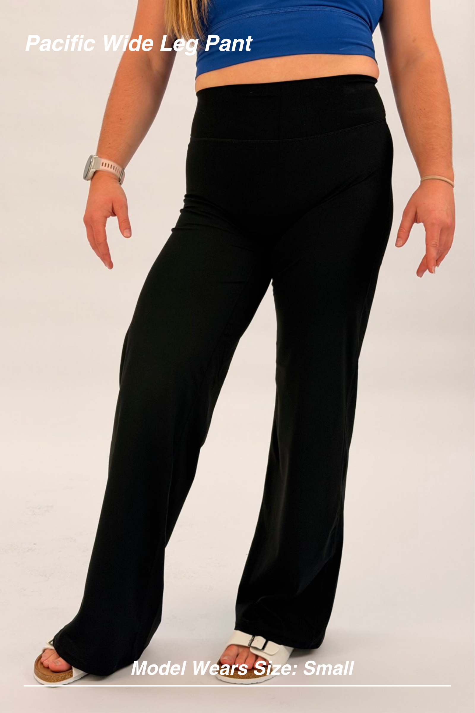 Mint Activewear Pacific Wide Leg Pant in black, front close-up of the smooth high waistband and loose wide-leg drape.