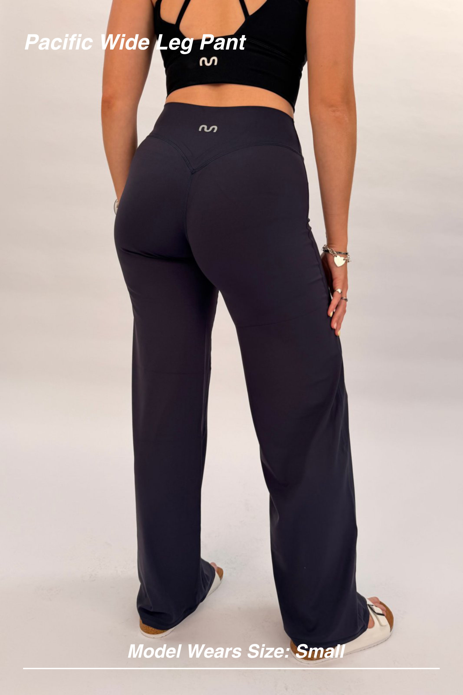 Mint Activewear Pacific Wide Leg Pant in navy, back view showing the sculpted high-waisted fit and wide-leg length.