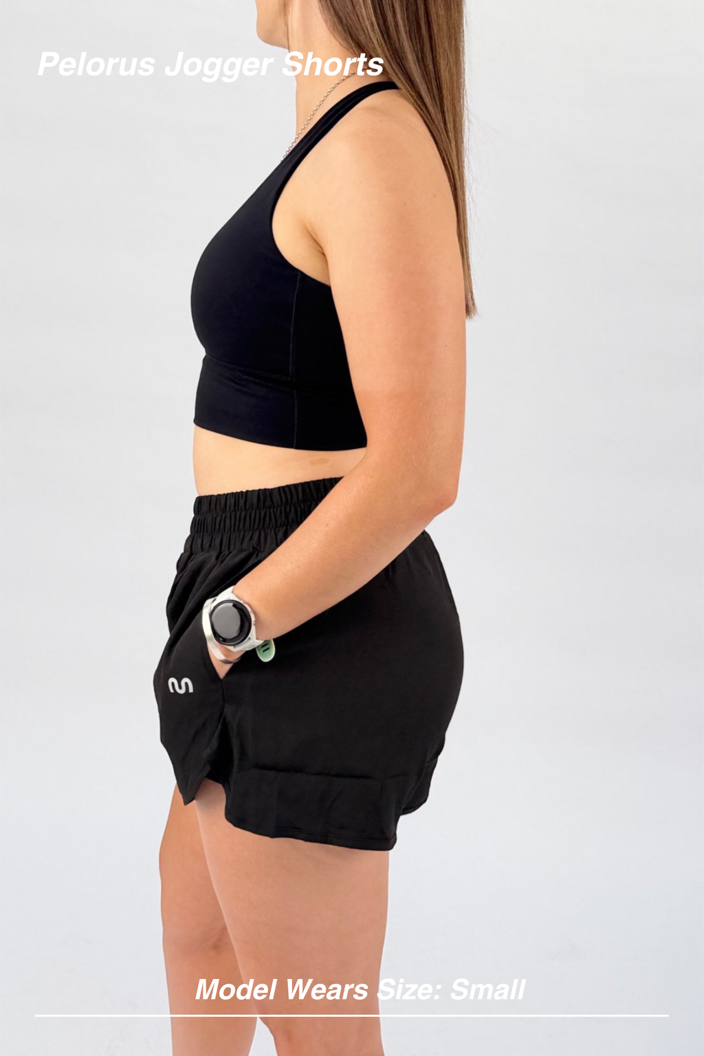 Mint Activewear Pelorus Jogger Shorts in black, side view showing the inner liner and curved hem.