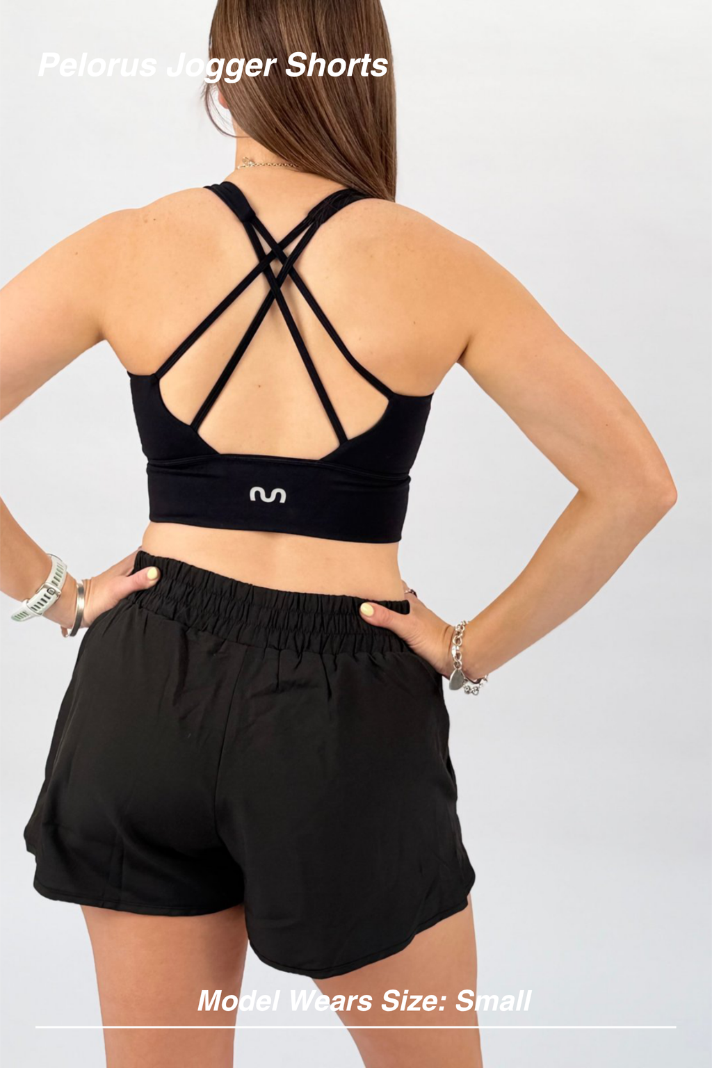 Mint Activewear Pelorus Jogger Shorts in black, back view showing the elastic waistband and relaxed drape.