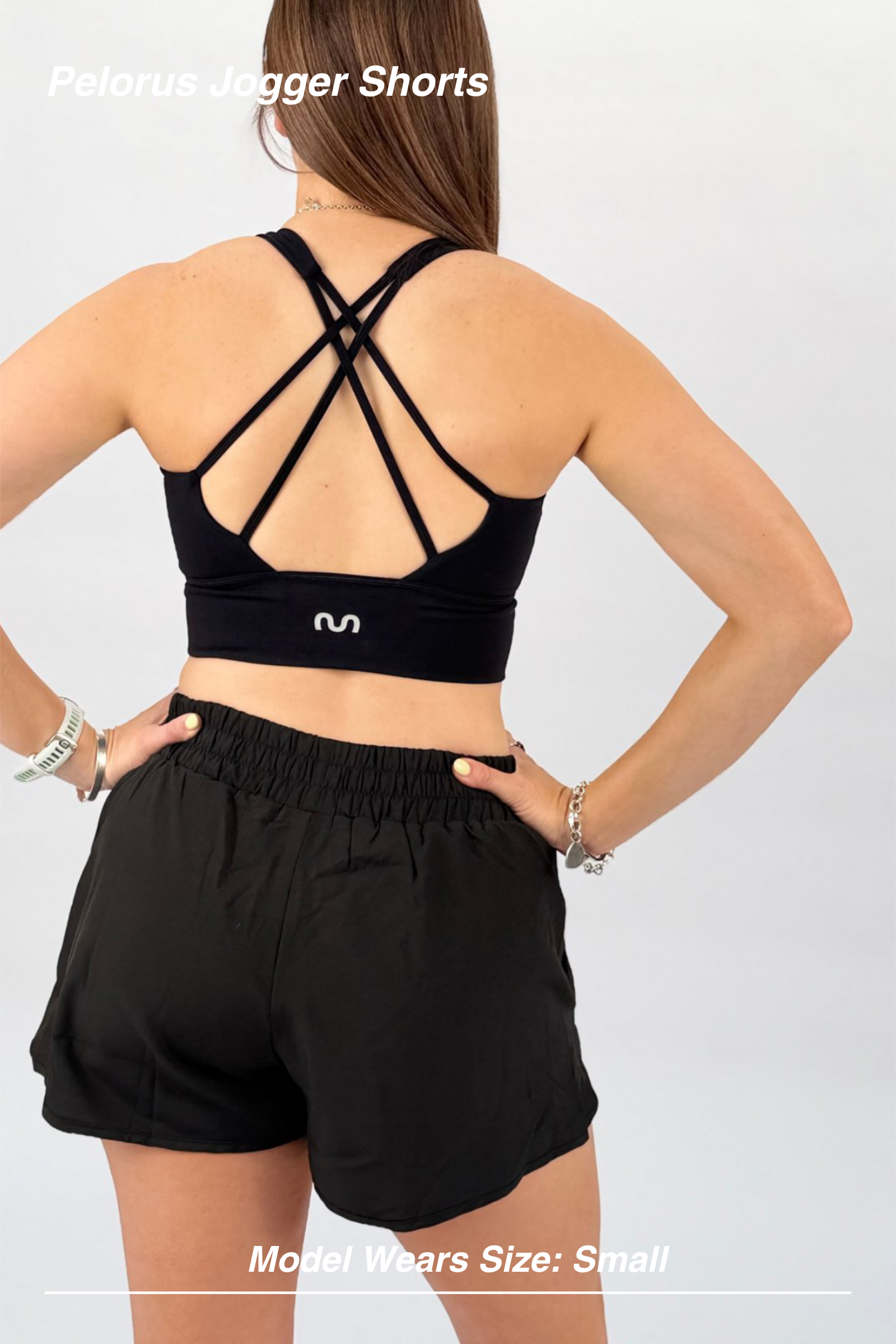 Mint Activewear Pelorus Jogger Shorts in black, back view showing the elastic waistband and relaxed drape.