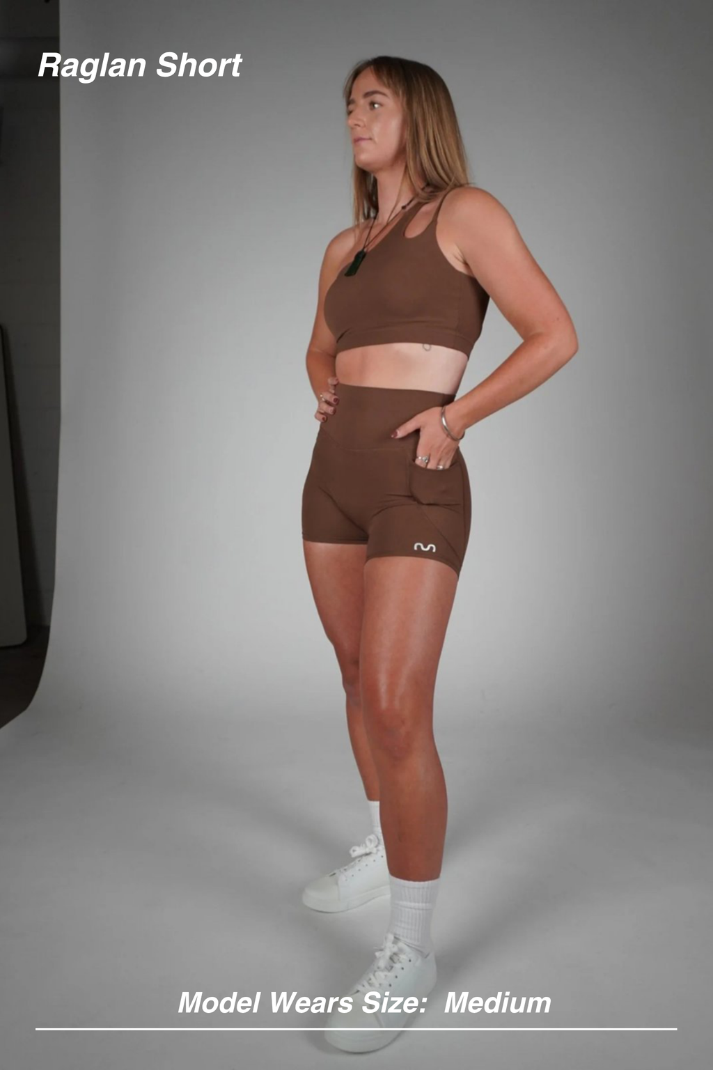 Mint Activewear Raglan Short in chocolate brown, full-length side view on a model with a matching sports bra.