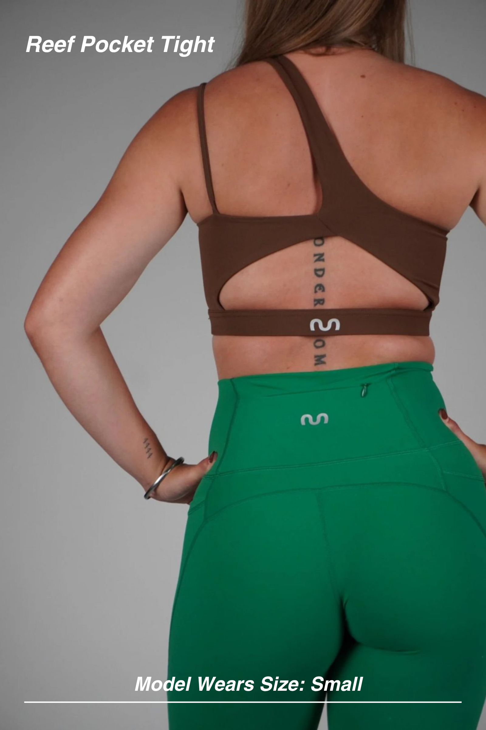 Mint Activewear Reef Pocket Tight in green, back detail of the contoured waistband and rear zip pocket.