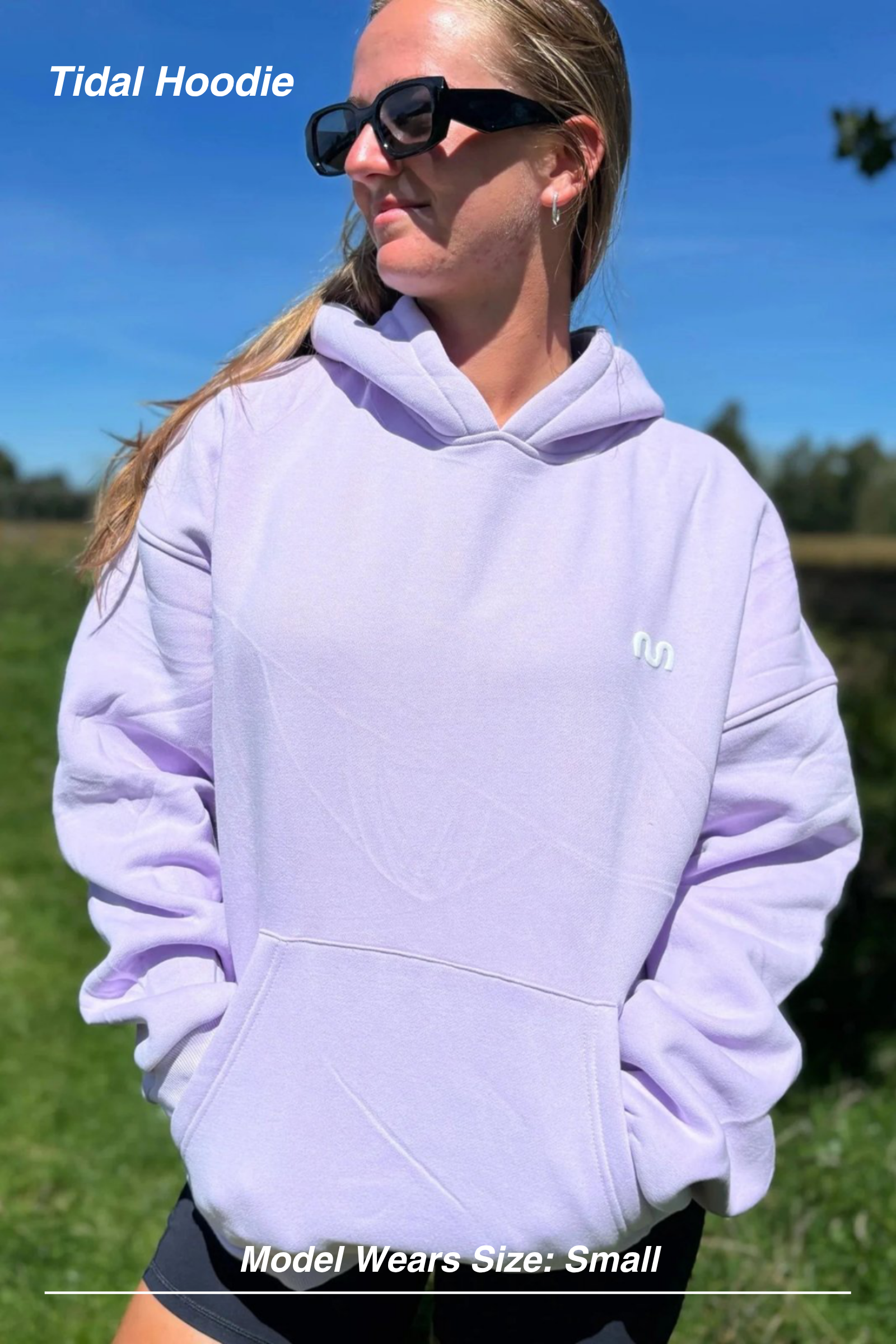Mint Activewear Tidal Hoodie in lilac, front view worn outdoors with the relaxed oversized body.